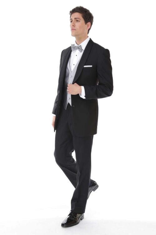 A man in a black tuxedo posing for an After Six Lino rental or tuxedo rental.