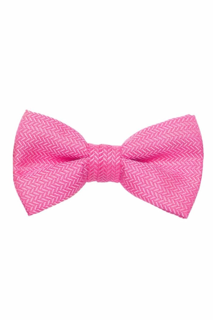 A pink bow tie on a white background, perfect for suit rental or tuxedo rental.