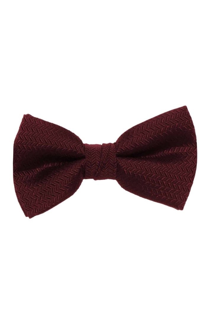 A burgundy bow tie, suitable for tuxedo rental.