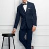 A man in an Allure Charcoal tuxedo, showcasing the elegance of suit rental.