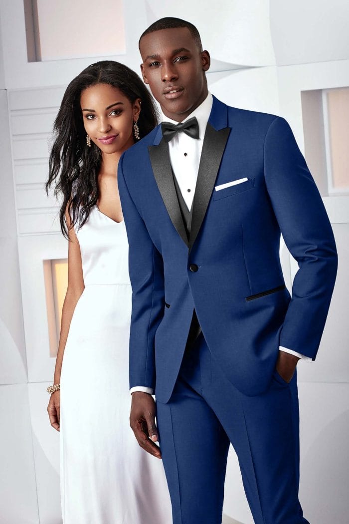 A couple in an Allure Charcoal tuxedo rental.