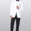 A man in a white tuxedo posing for a photo at an After Six Gerard suit rental shop.