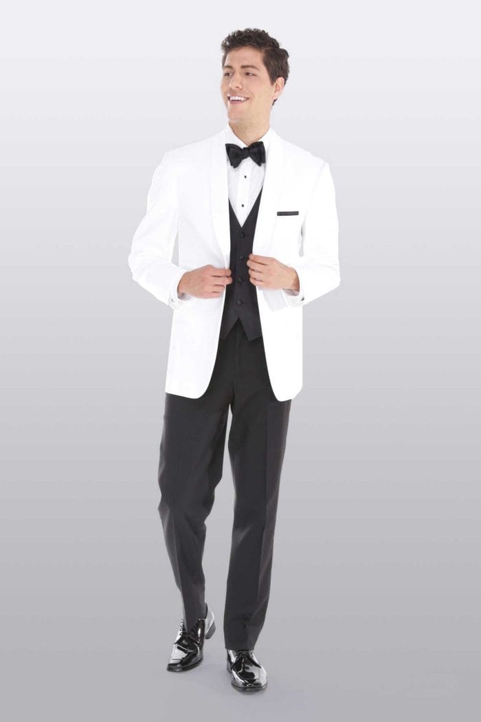A man in a white tuxedo is posing for After Six Gerard rental.