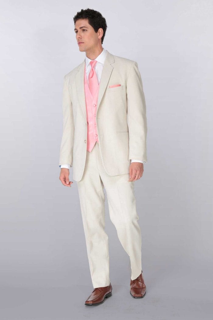 A man in an After Six Gerard suit rental with a pink tie.
