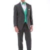 A man in an Allure Charcoal tuxedo for suit rental with a green bow tie.