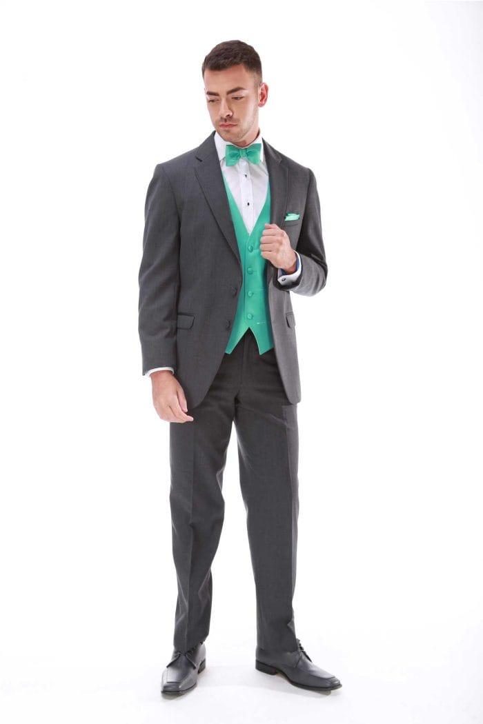 A man in an Allure Charcoal rental with a green bow tie.