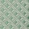 A green and white geometric pattern on a fabric, perfect for suit rental.