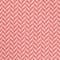 A close up image of a pink herringbone fabric suitable for suit rental.