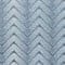 A close up image of a blue chevron pattern, suitable for suit rental.