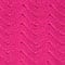 A close up of a bright pink fabric available for suit rental.