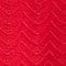 A close up of a red fabric with a chevron pattern available for suit rental.