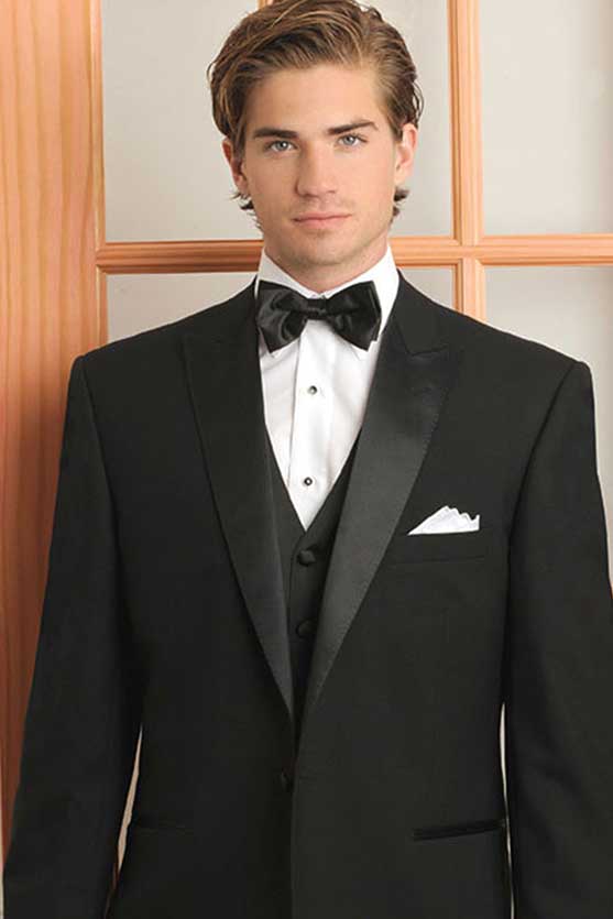 A young man wearing a stylish Galante Pick Stitch tuxedo rental.