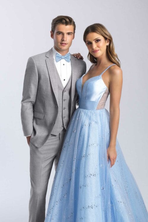 A man and woman in a suit and Allure Heather Grey prom dress.