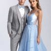 A man and woman in a suit and Allure Heather Grey prom dress.