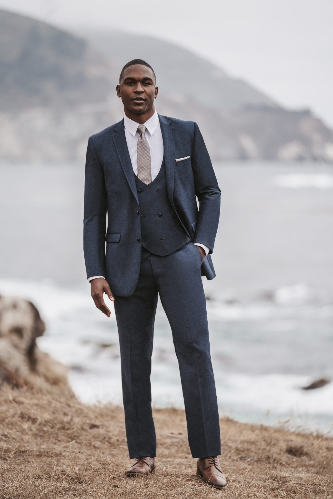 grey tux with navy blue tie